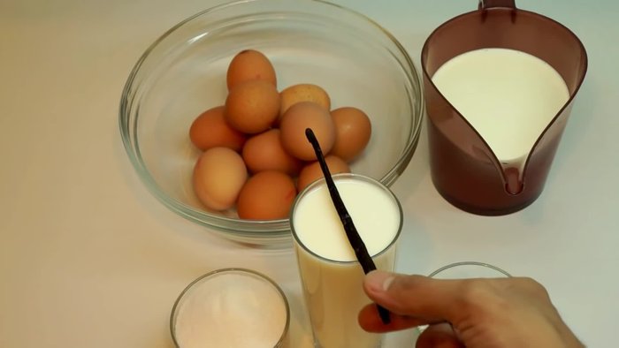 Préchauffer le four et préparer la crème pâtissière : Fendre la gousse de vanille en deux et récupérer les graines. Les ajouter à la crème.