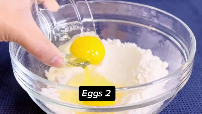 Préparation de la pâte à crêpes : Mélanger la farine, les œufs, le lait, le sel et l'eau. Laisser reposer 20 minutes.