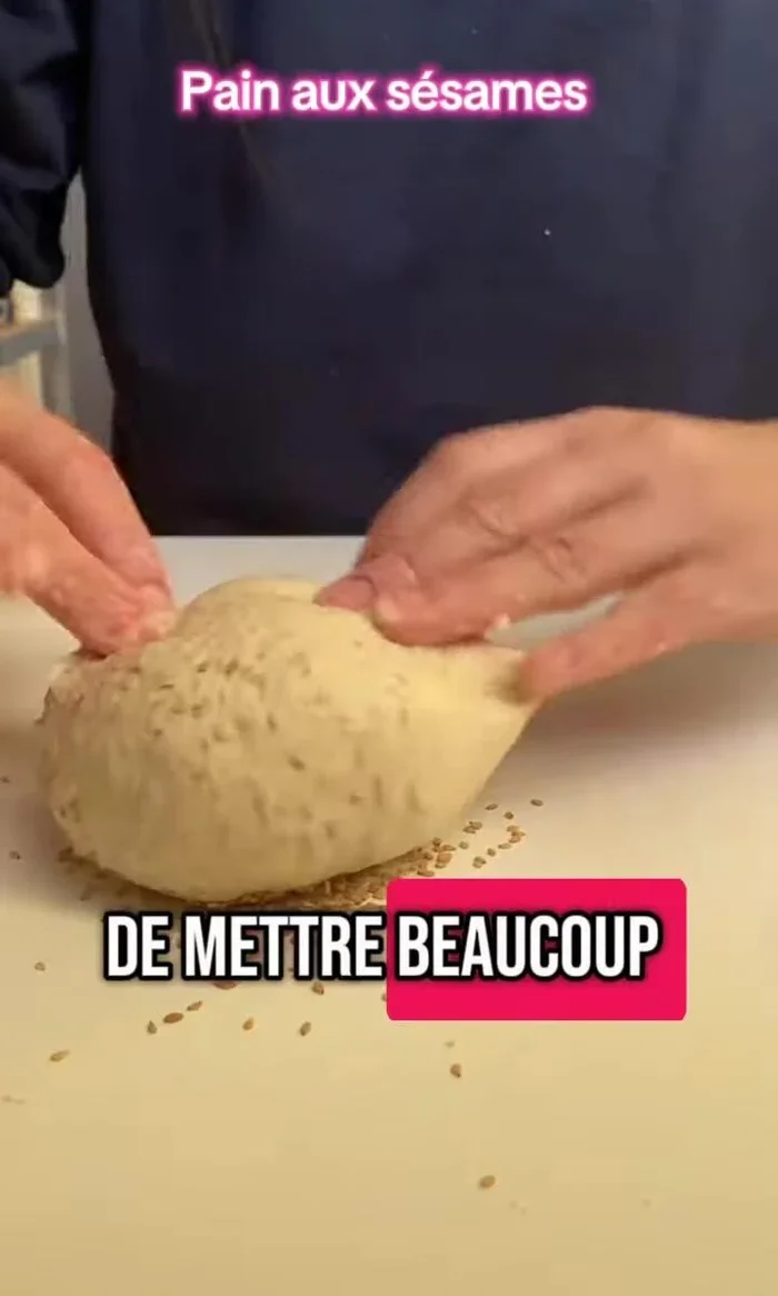 Garnir généreusement le dessus du pain de graines de sésame. [37.2]